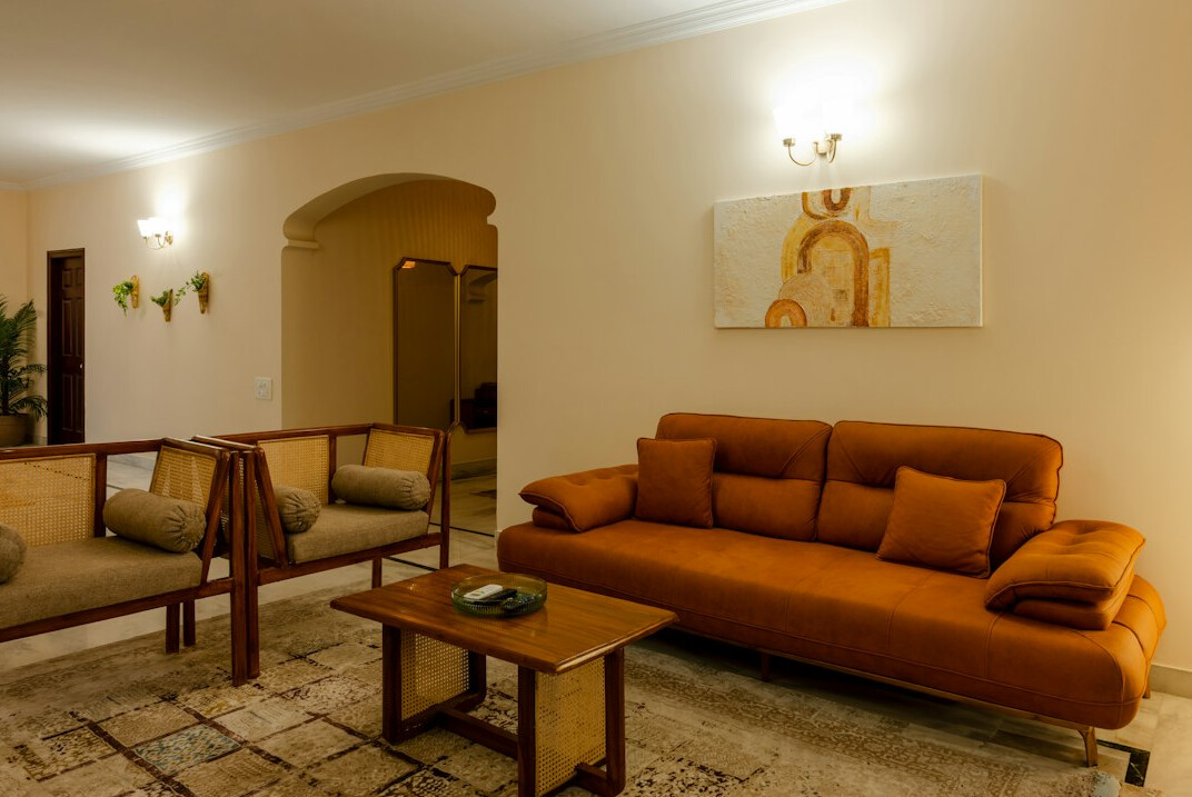 Elegant 1990s villa lounge with velvet sofas and warm lighting