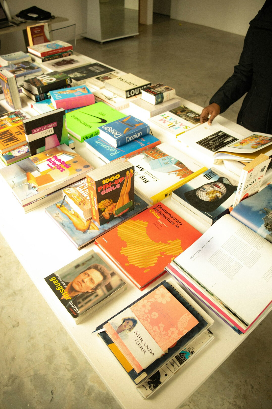 Swiss editorial team reviewing magazine layouts in a bright office
